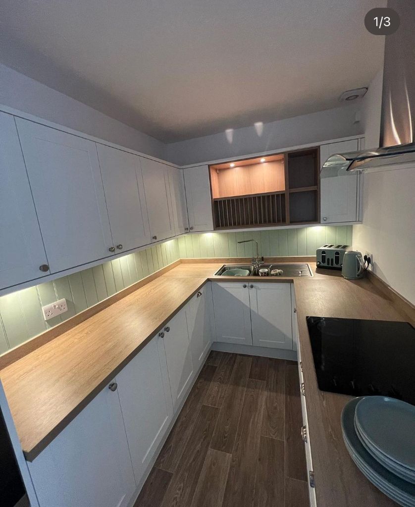 White kitchen with professional under-cabinet LED lighting