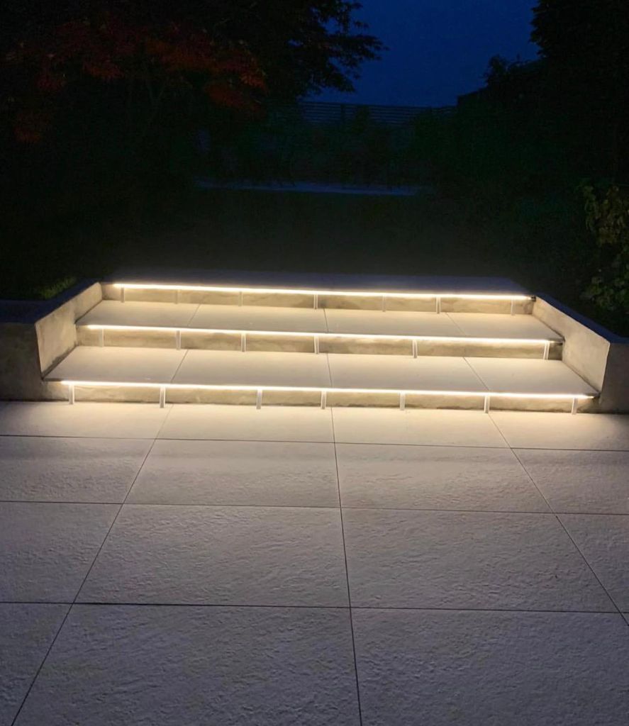 Illuminated outdoor steps at night - garden lighting installation